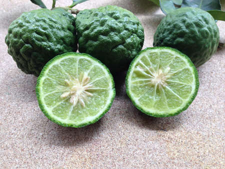 Kaffir Lime or Bergamot on plywood backgroundの写真素材