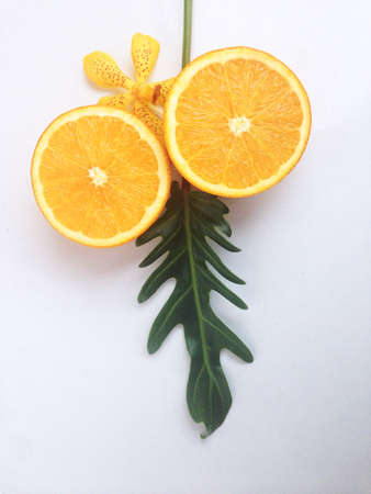 Fresh orange and slices on white background.の写真素材