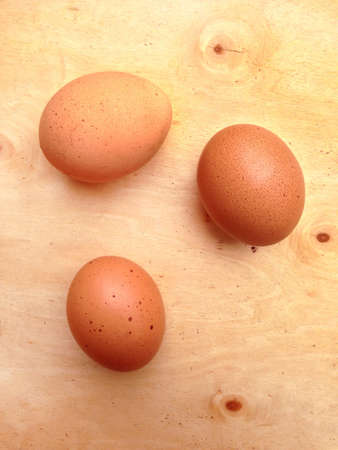 chicken egg a on wooden background