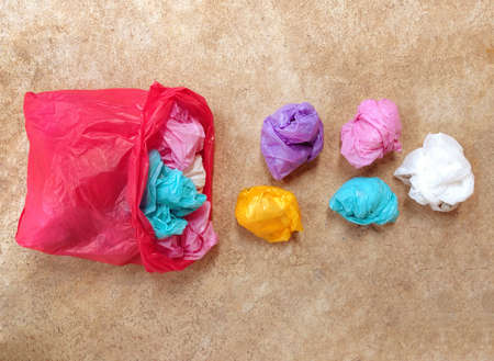 Colorful plastic bag on cement floorの写真素材