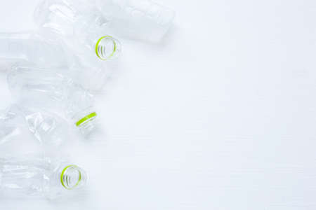 Empty plastic water bottle for recycling isolated on over white background.の写真素材