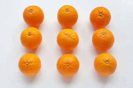 Fresh orange citrus fruit on white background. Top view