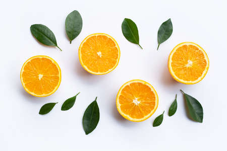 Top view of orange fruits and leaves isolated on white background.の写真素材