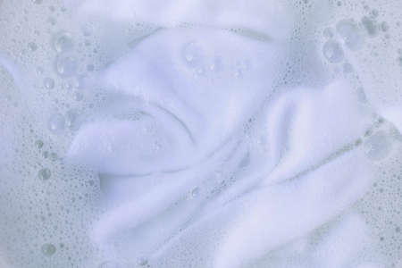 Soak a cloth before washing, white clothの写真素材