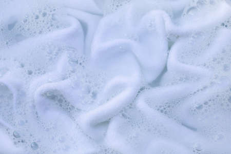 Soak a cloth before washing, white clothの写真素材