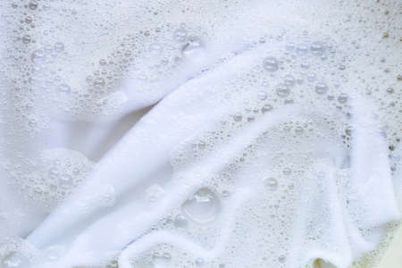 Washing clothes, white clothes soaked.
