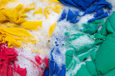 Washing clothes, colorful clothes soaked.の写真素材