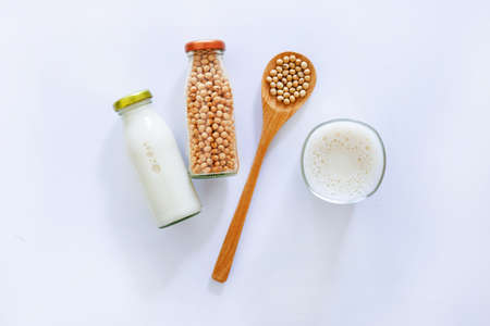Soy milk and soybean on white background.の写真素材