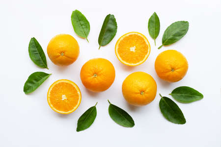 Fresh orange citrus fruit with leaves isolated on white wooden background.  Top viewの写真素材