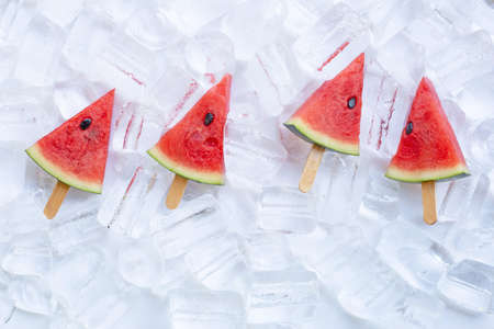 Sweet watermelon slice ice cream on ice background