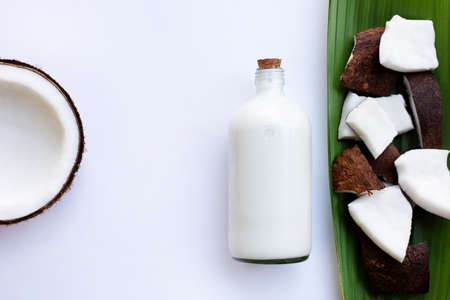 Coconut milk and coconut on  white backgroundの写真素材