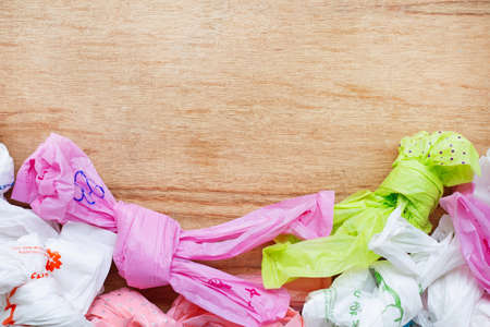 Plastic waste , Plastic bags on wooden background.の写真素材