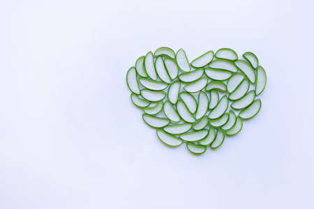 aloe vera slices heart shaped on white background. Copy spaceの写真素材