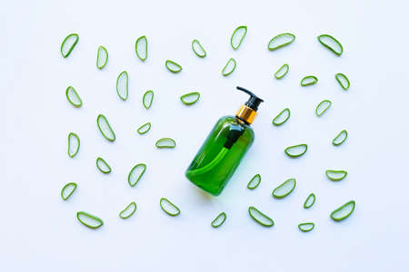 Bottle of products for spa or skin care cosmetic aloe vera gel and Aloe Vera slices isolated on white backgroundの写真素材