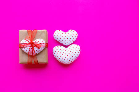 Valentine's heart with gift box  on pink background. Top view