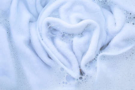 Soak a cloth before washing, white clothの写真素材