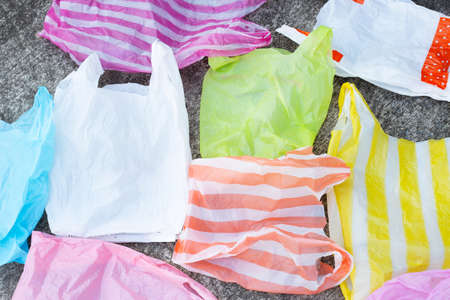 Plastic bags on cement floor background.の写真素材