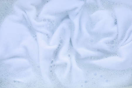 Soak a cloth before washing, white cloth