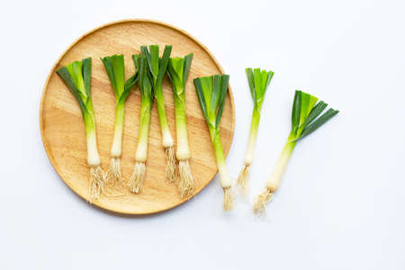 Young green garlic on white backgroundの写真素材