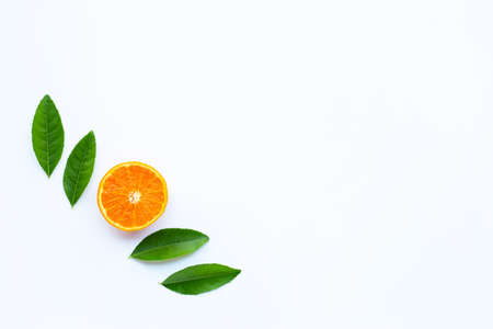 High vitamin C,  Fresh orange citrus fruit with green leaves on white background. Copy space
