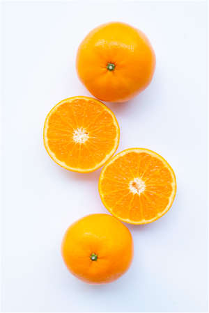 Fresh orange citrus fruit on white background.