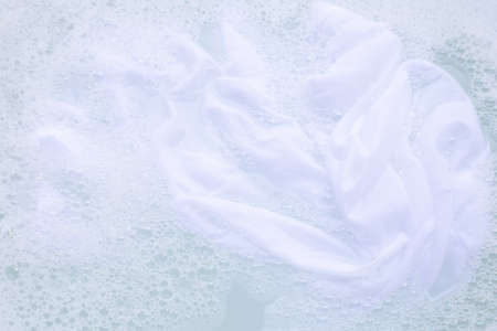 Soak a cloth before washing, white clothの写真素材