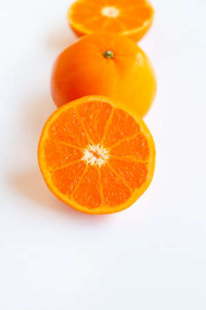 Fresh orange citrus fruit on white background.