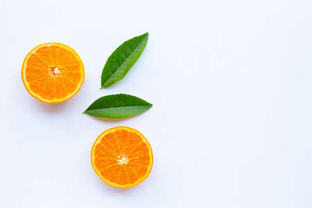 High vitamin C,  Fresh orange citrus fruit with green leaves on white background. Copy spaceの写真素材