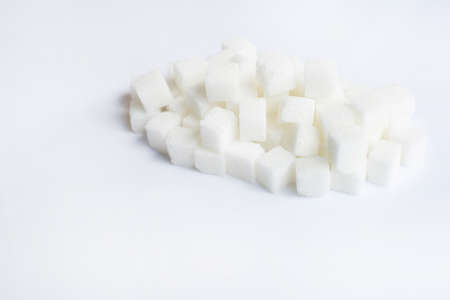 Sugar cubes on  over white backgroundの写真素材