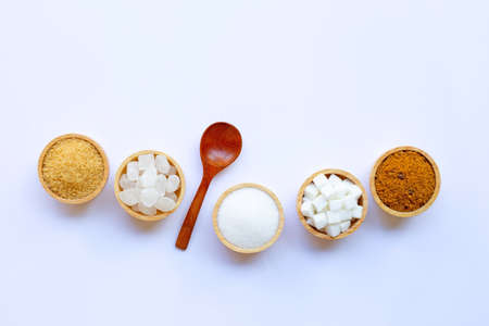 Various types of sugar on white background.