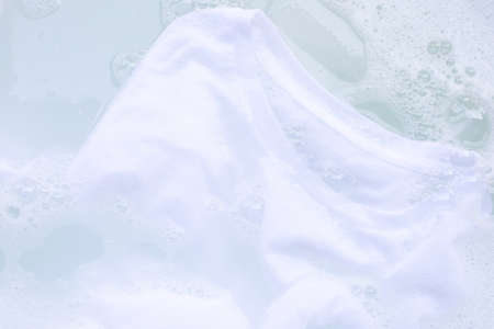 Soak a cloth before washing, white T-shirtの写真素材