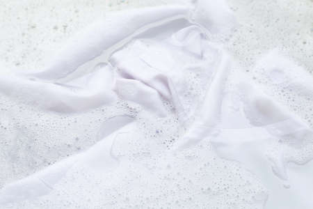 Soak a cloth before washing, white shirt