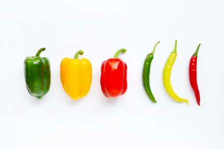 Different colors bell peppers and chili peppers isolated on white backgroundの写真素材