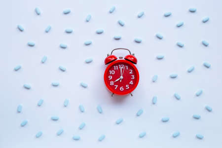 Red alarm clock ring with "PrEP" ( Pre-Exposure Prophylaxis). used to prevent HIV. Top viewの写真素材