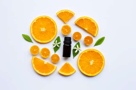 Orange essential oil on white background. Top viewの写真素材