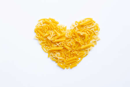Different types of dry pasta on white backgroundの写真素材