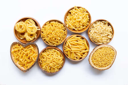 Different types of dry pasta on white backgroundの写真素材