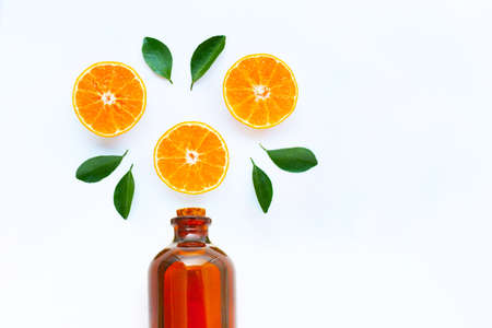 High vitamin C, Orange fruits with essential oil bottle on white background. Copy spaeの写真素材