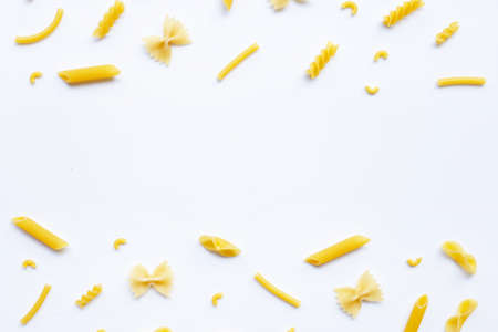 Different types of dry pasta on white backgroundの写真素材