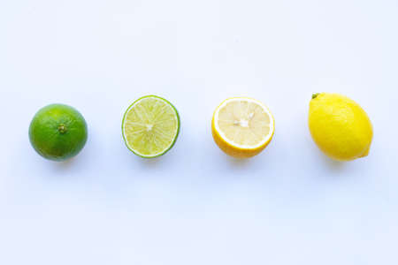 Ripe lemons and limes on white background.の写真素材
