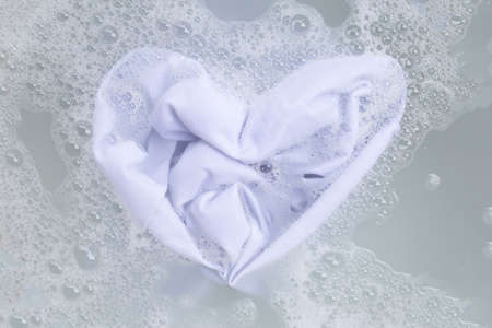 Soak a cloth before washing, white cloth, Heart shapeの写真素材
