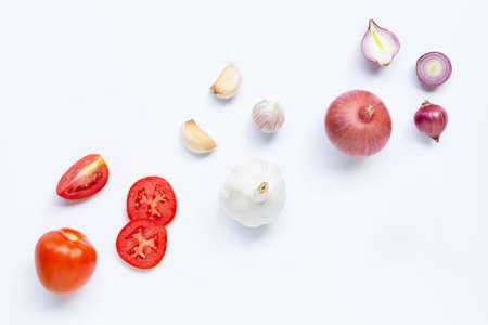 Fresh vegetables on white background.  Tomato, Red onion, garlic,  Healthy eating conceptの写真素材