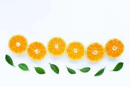 High vitamin C, Orange fruits with leaves on white background. Top view