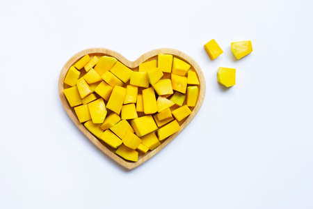 Green pumpkin pieces cut on white backgroundの写真素材