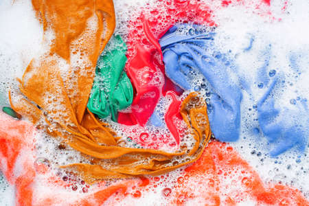 Color clothes soak before washing. Top view