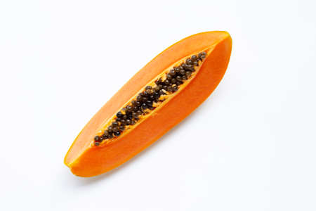Cut ripe papaya fruit with seed on white backgroundの写真素材