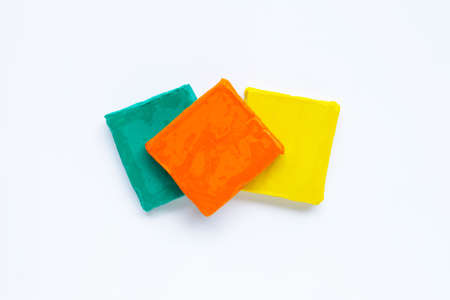 Colorful plasticine clay on white background.