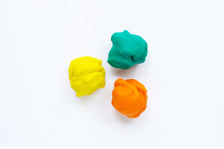 Colorful plasticine clay on white background.