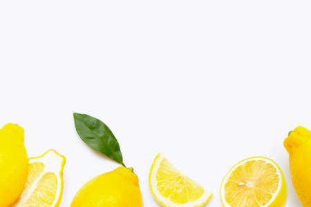Fresh lemon with slices isolated on white background.
