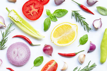 Various fresh vegetables and herbs on white background. Healthy eating concept